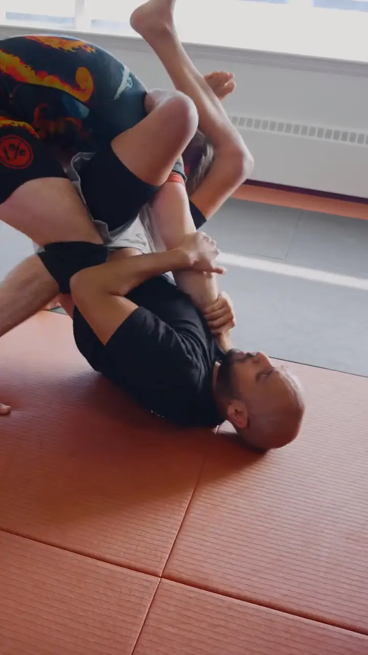Two grapplers shake hands on the mats before a live roll at Modern Warrior Academy.